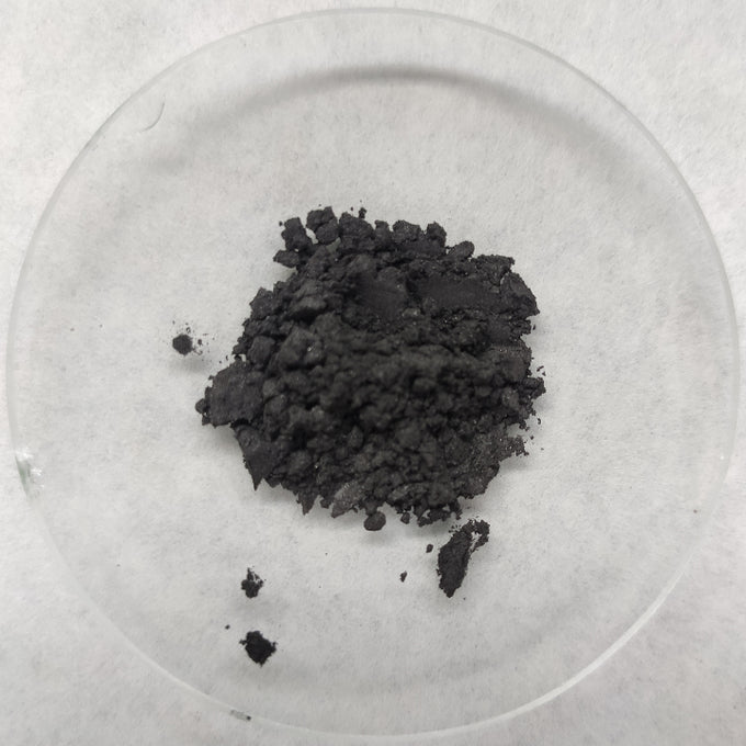 Activated charcoal powder on a white background