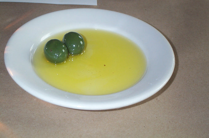 Green olives in golden olive oil